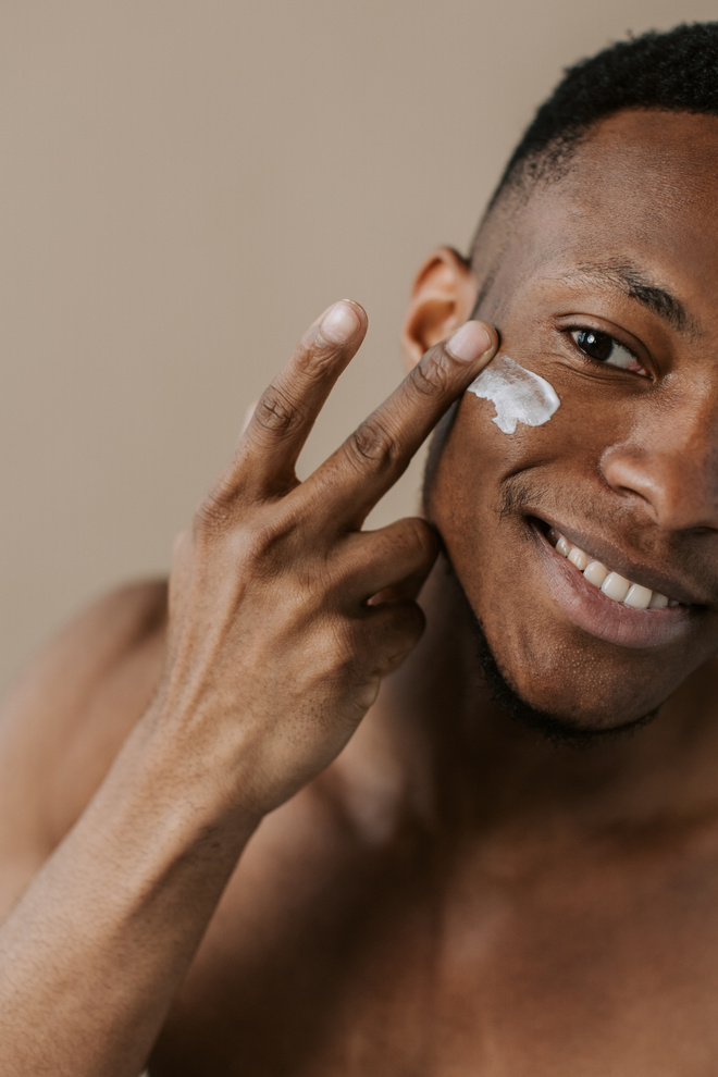 Man Applying Foam Cleanser on Face